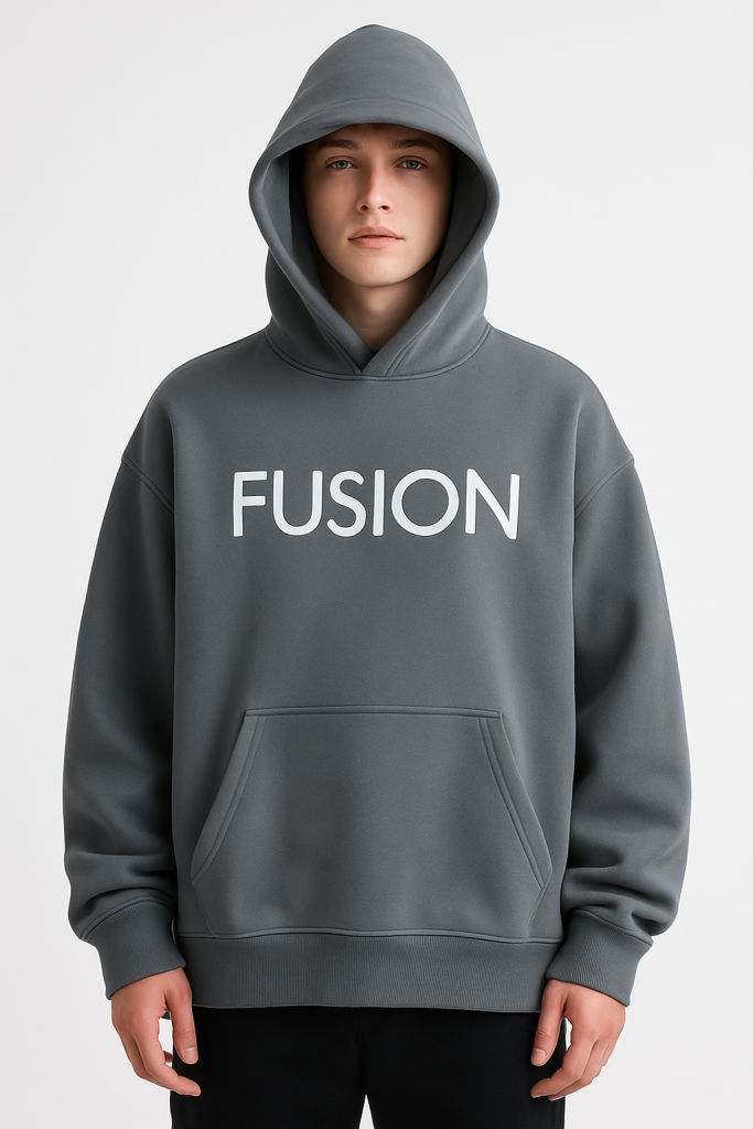 A person in a Dark Fusion - Oversize Fleeced Hoodie with the hood up stands against a plain white background. The affordable luxury hoodie features “FUSION” in large white letters across the chest.