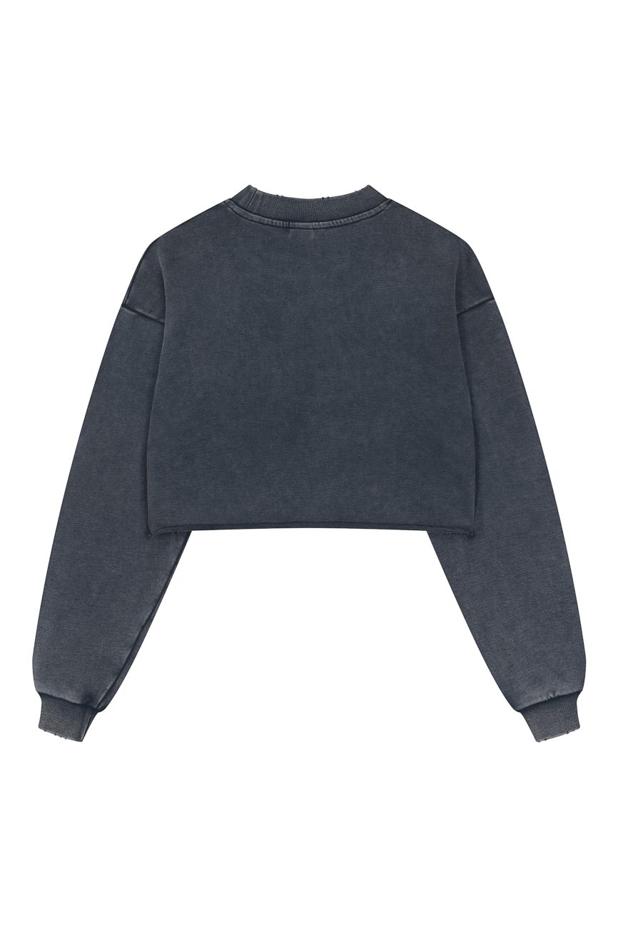 The Womens Snow Washed Raw Edge Cropped Sweatshirt in dark gray is shown laid flat, back up. Its ribbed collar, cuffs, hem, and washed finish offer effortless style and affordable luxury.