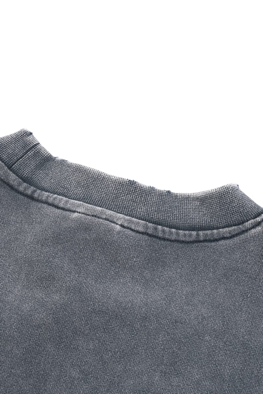 Close-up of the neckline and upper back of the Womens Snow Washed Raw Edge Cropped Sweatshirt, featuring textured gray fabric and visible stitching—an affordable luxury piece.