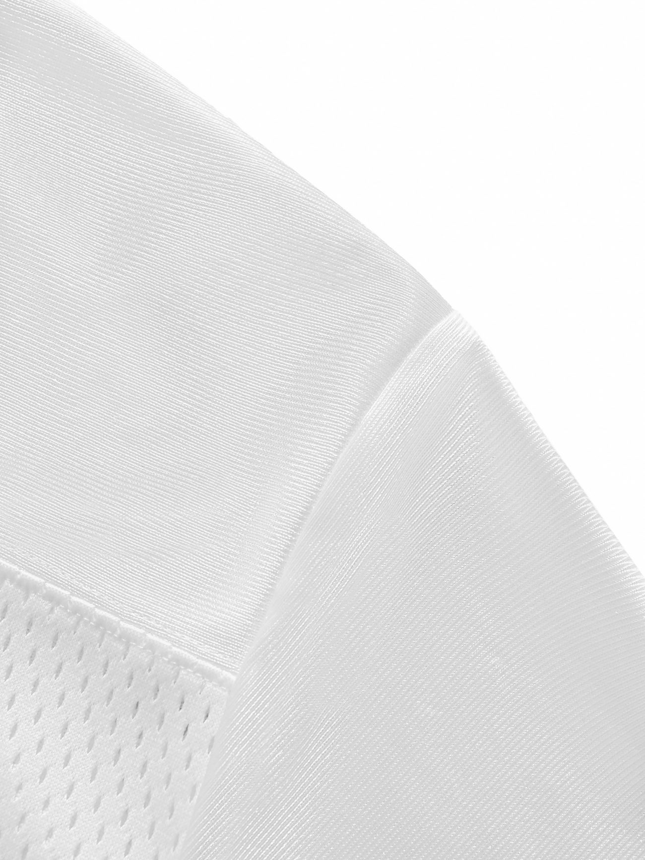Close-up of the Fifteen - light Taped Mesh T-Shirts white fabric, featuring smooth and mesh-like textures that highlight affordable luxury details—characteristic of this stylish shirt.