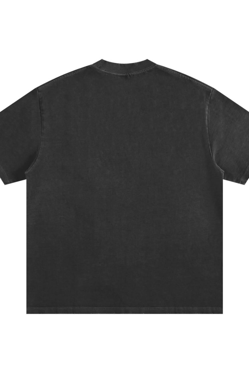 Back view of the Toile De Jouy - Heavyweight Vintage Washed Frayed T-Shirt, plain black with short sleeves, laid flat on a white background. This loose fit tee features a minimalist style and affordable luxury with no visible logos or designs.