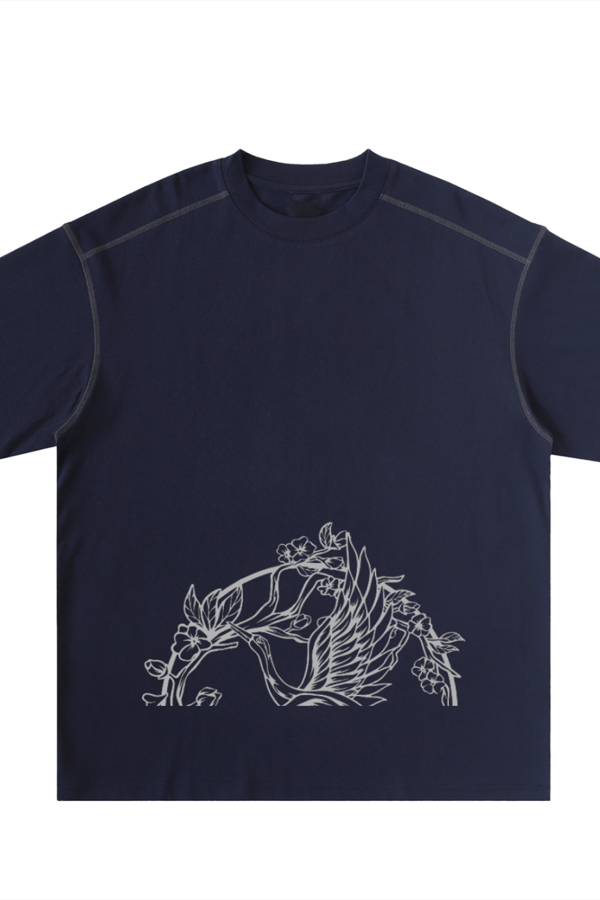 The Crane - Oversized Contrast-Stitched Cotton Tee in navy features a white minimalist line drawing of a bird, flowers, and leaves on the lower front for relaxed comfort and timeless, nature-inspired style.