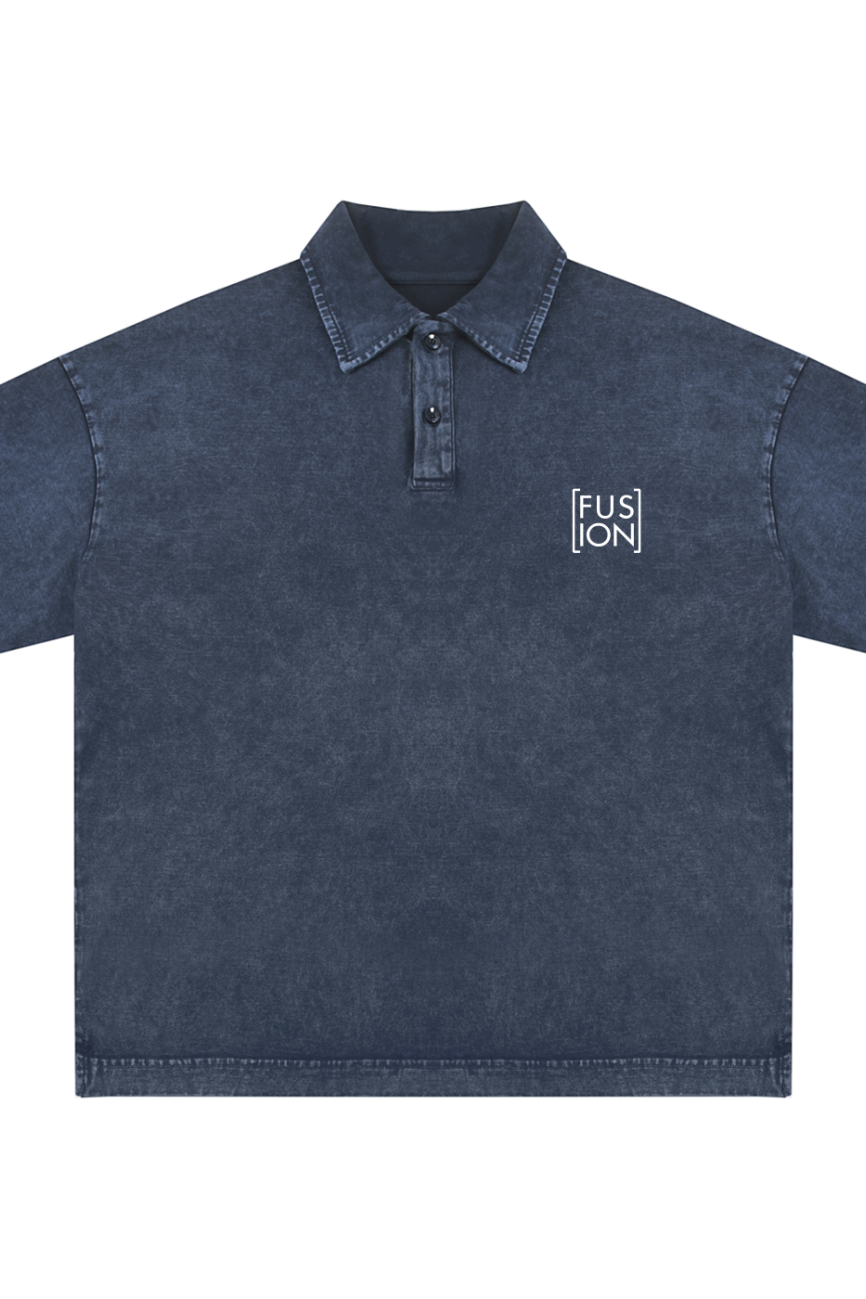 The Heavyweight Snow-Washed Polo T-Shirt is a short-sleeve, dark blue denim shirt with a collar, three buttons, and a small white [FUSION] logo on the left chest—style and comfort from Affordable Luxury Clothing.
