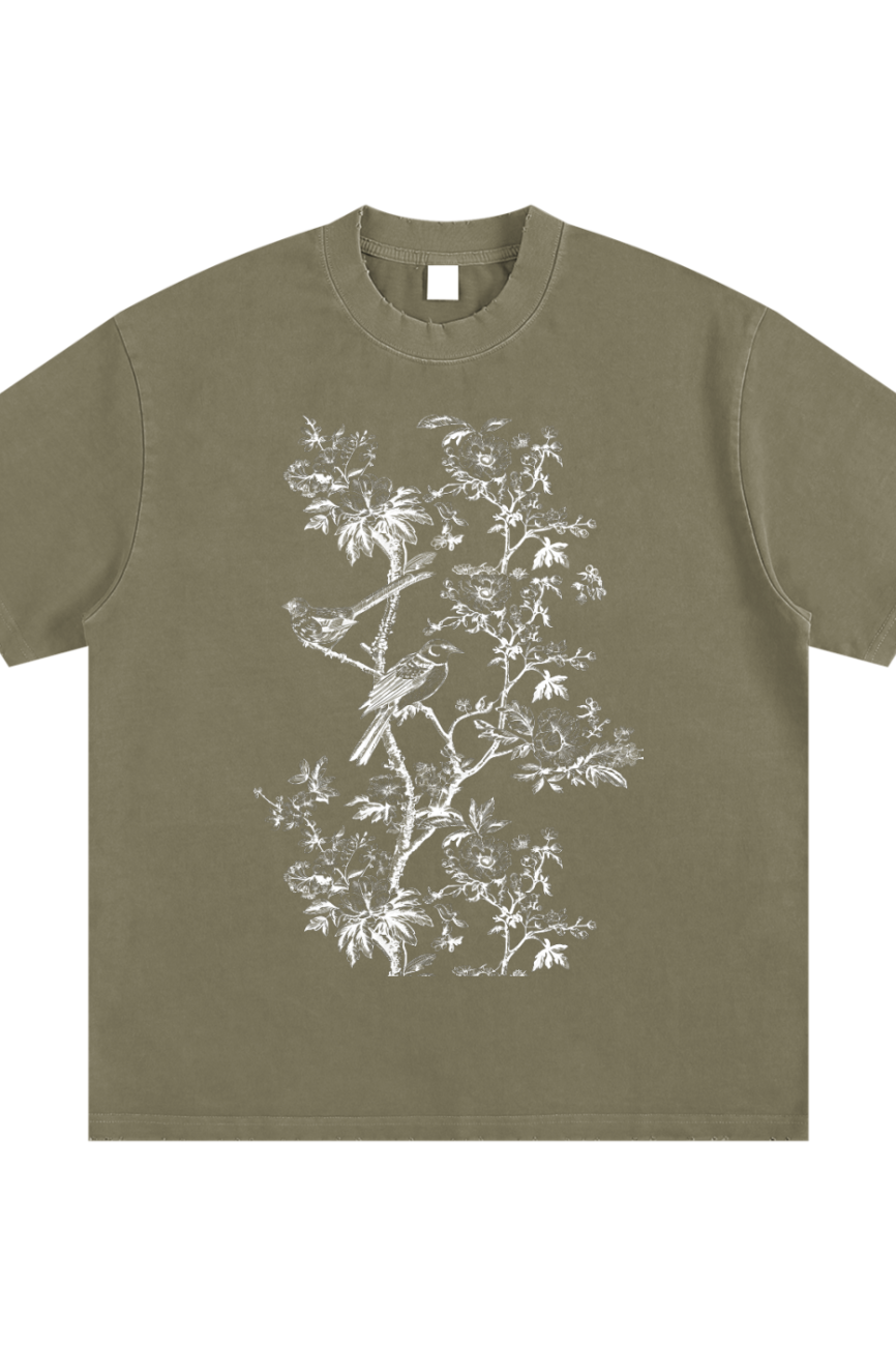 Experience affordable luxury with the Toile De Jouy Heavyweight Vintage Washed Frayed T-Shirt in olive green, featuring an oversized fit and a white botanical illustration of birds and branches on the front.