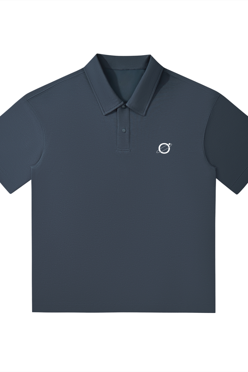 The Drop Shoulder Short-Sleeve Polo is a navy blue shirt with a collar, button placket, and a small white planet logo on the left chest—perfect for those seeking affordable luxury. Displayed on a plain white background.