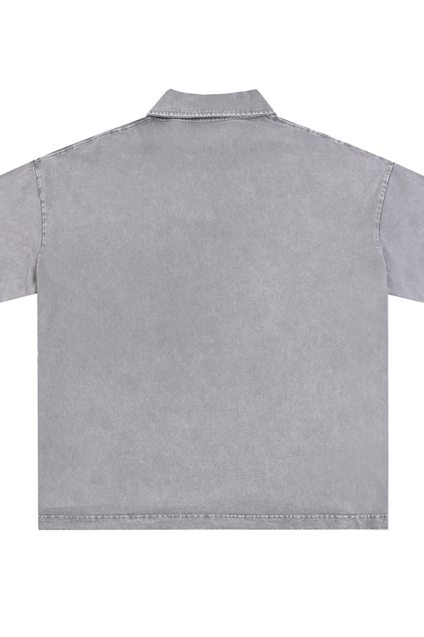 The Fusion Heavyweight Snow-Washed Polo T-Shirt is shown from the back, with a collar, simple edge stitching, and a subtly faded finish—ideal for those seeking affordable luxury.