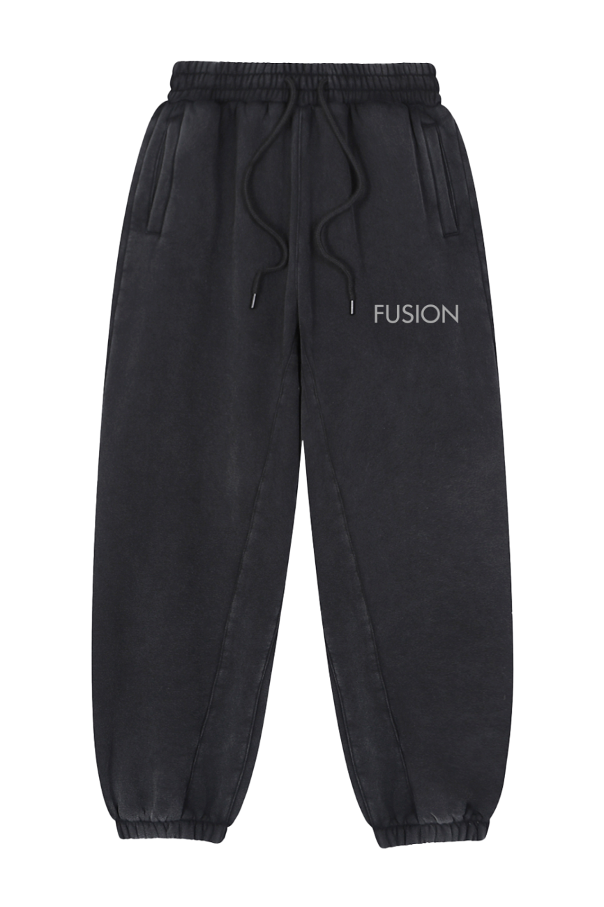 The Fleeced Jogger Sweatpants are black with white text, delivering affordable luxury and everyday comfort in a stylish design.