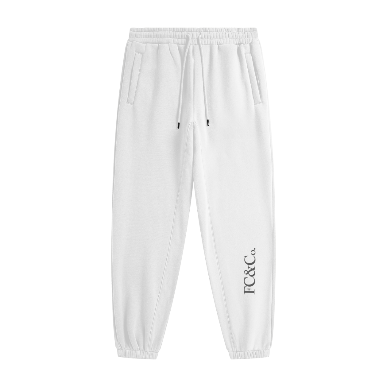 Streetwear Unisex Fleece Joggers feature an elastic waistband with drawstring, side pockets, elastic cuffs, and FC&CO. printed vertically by the left ankle—ideal for anyone seeking everyday comfort in affordable luxury style.