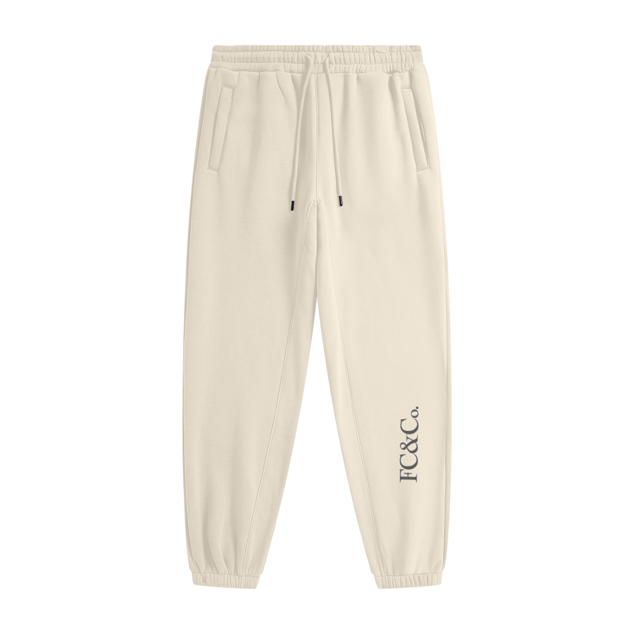Streetwear Unisex Fleece Joggers in beige feature an elastic waistband, drawstring, side pockets, and FC&Co. print by the left ankle—ideal affordable luxury for those who value both comfort and style.