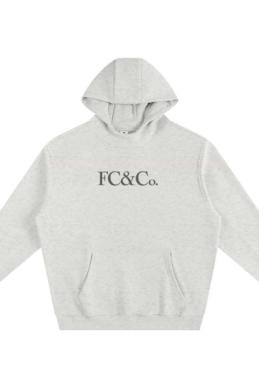 The Fleeced High Neck Hoodie is a light gray sweatshirt with “FC&Co.” in bold black serif across the chest, featuring a front pouch pocket and long sleeves. This affordable luxury piece is shown on a white background.