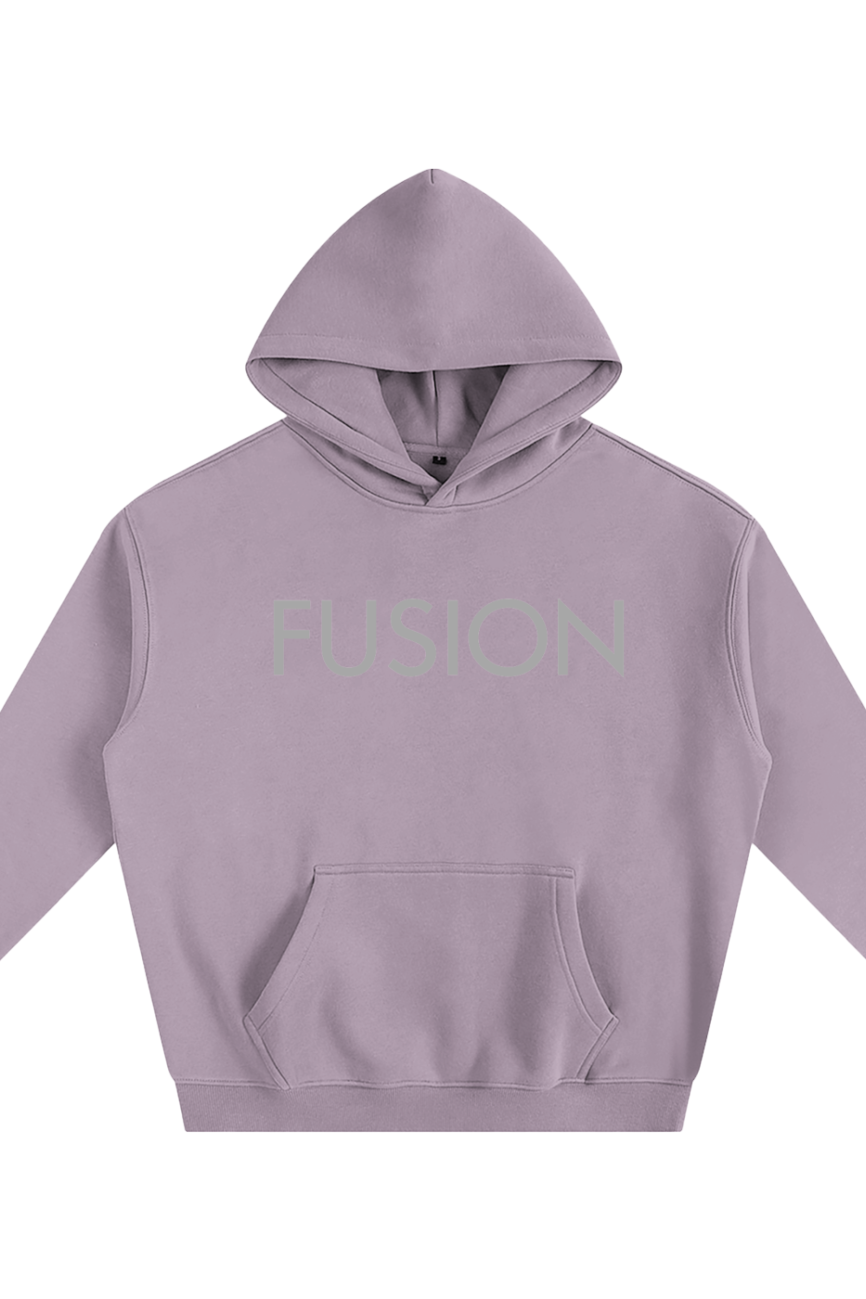 The Fusion Oversize Fleeced Hoodie features a lavender color, front pocket, and bold FUSION lettering—an ideal choice for fans of stylish, affordable luxury.