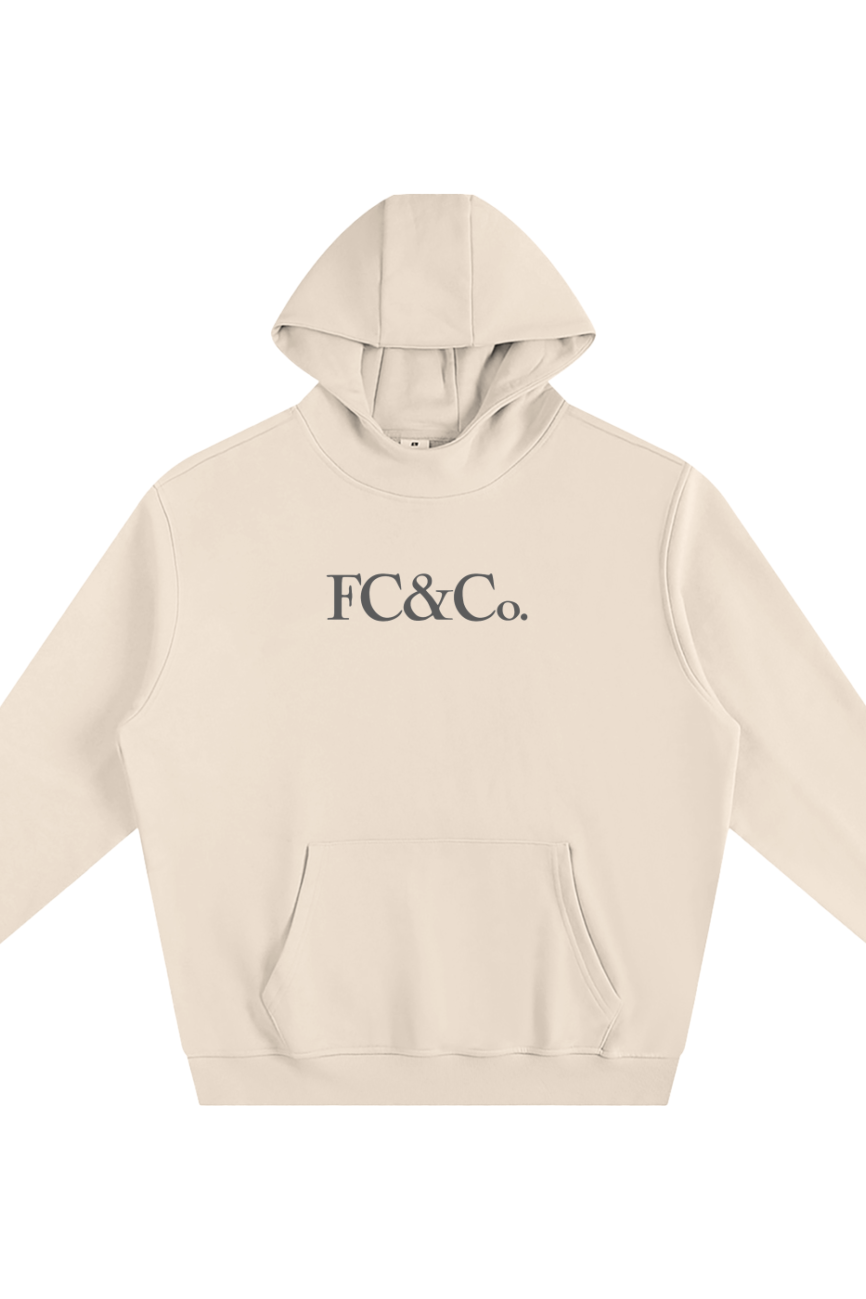 The Fleeced High Neck Hoodie is a beige sweatshirt with a front pocket and bold FC&Co. lettering, offering affordable luxury and effortless style—perfect for elevating your casual look.