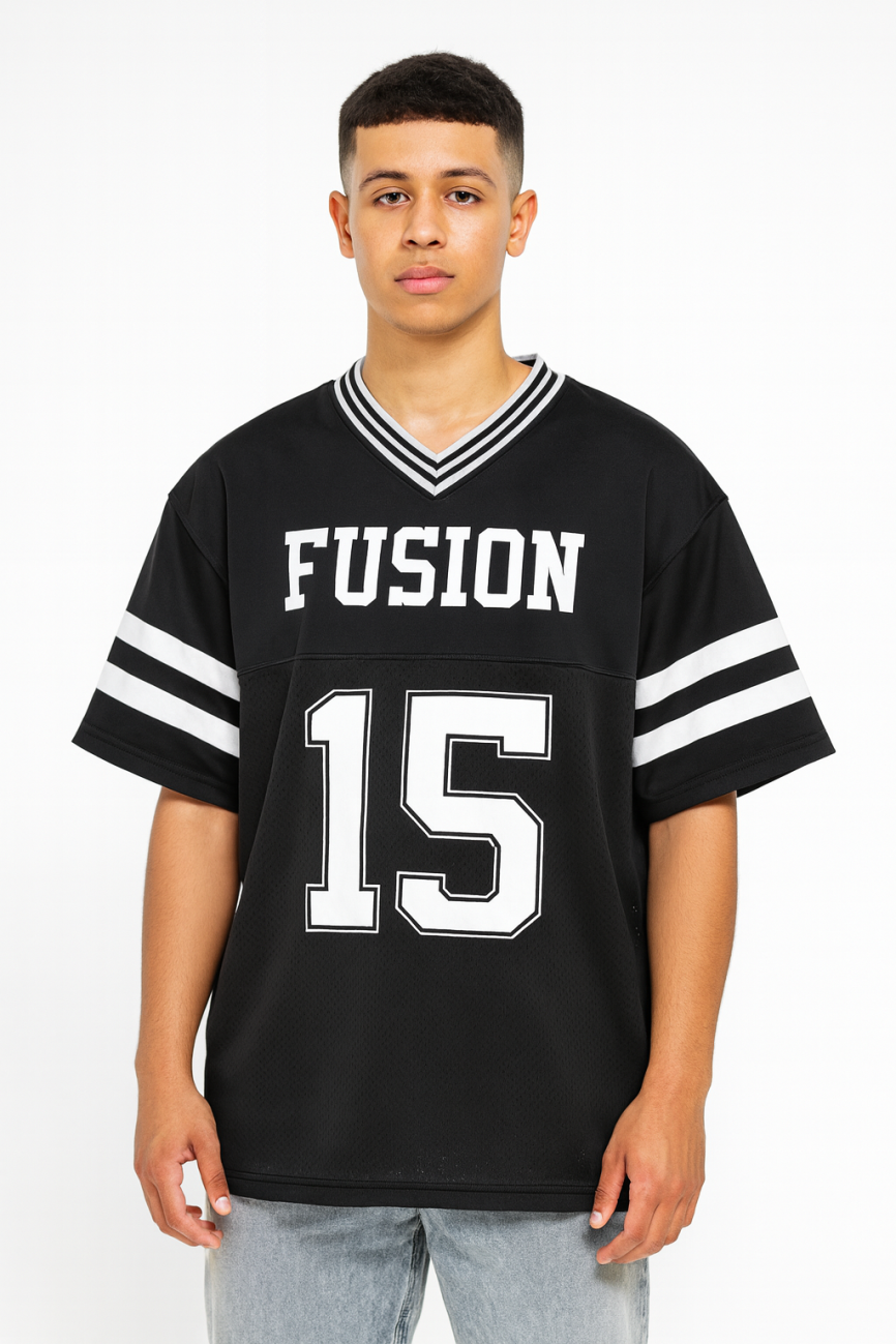 A young person faces forward in a Taped Mesh Boxy T-shirt—an affordable luxury black sports jersey with white sleeve stripes, FUSION on the chest, and the number 15 beneath—set against a plain white background.