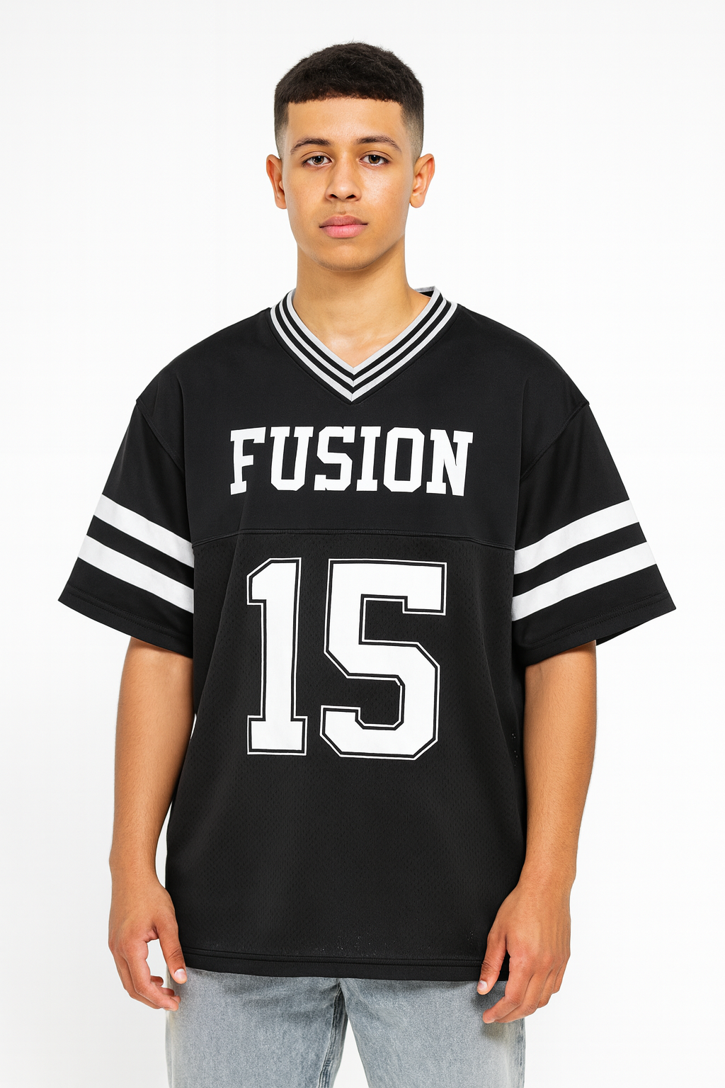 A young person faces forward in a Taped Mesh Boxy T-shirt—an affordable luxury black sports jersey with white sleeve stripes, FUSION on the chest, and the number 15 beneath—set against a plain white background.