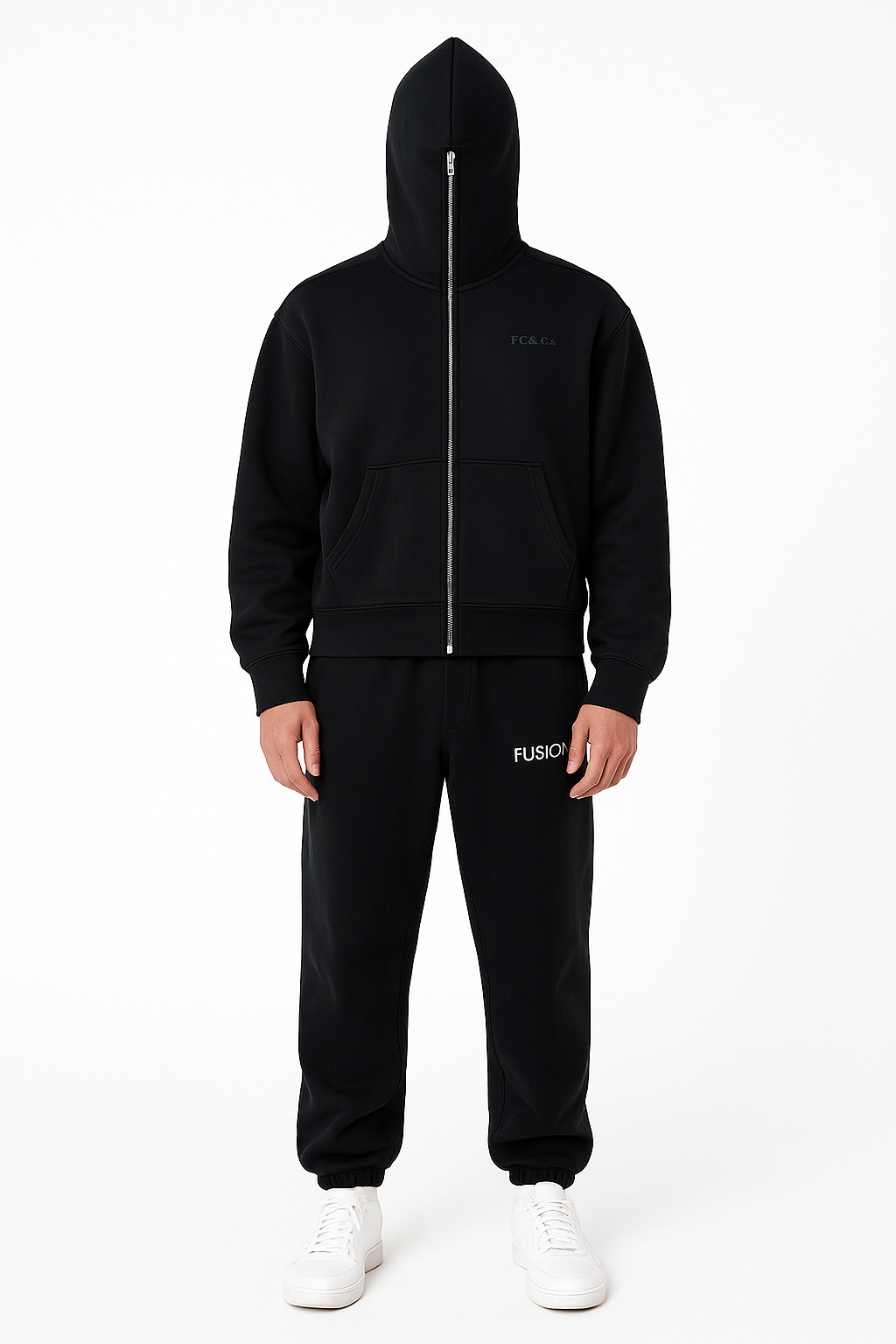 A person stands facing forward in an FC&Co. Fleeced Full-Zip Boxy Hoodie with the hood up, black FUSION sweatpants, and white sneakers—displaying affordable luxury apparel against a plain white background.