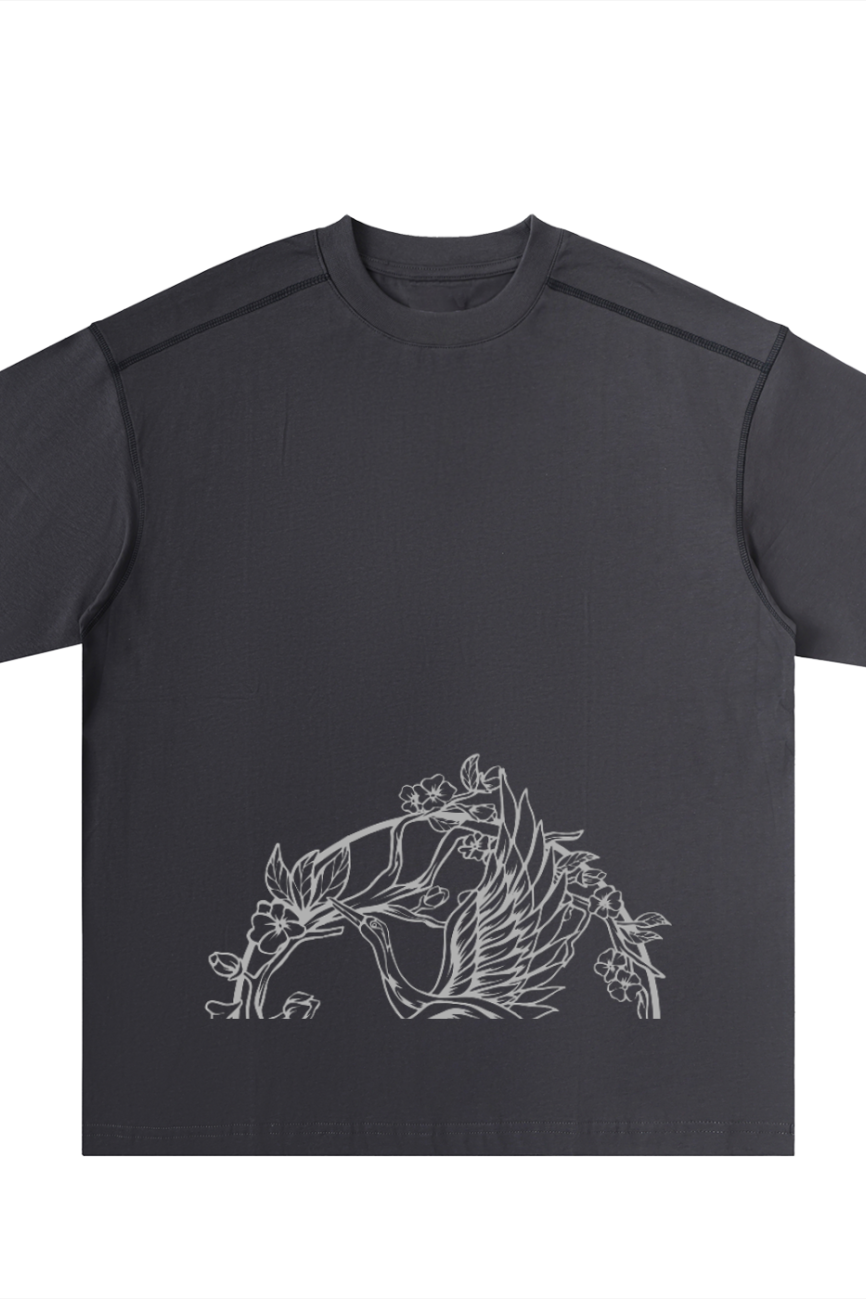 The Crane - Oversized Contrast-Stitched Cotton Tee is a black t-shirt from our Affordable Luxury Clothing line, featuring minimalist white line art of leaves and flowers near the front bottom hem.