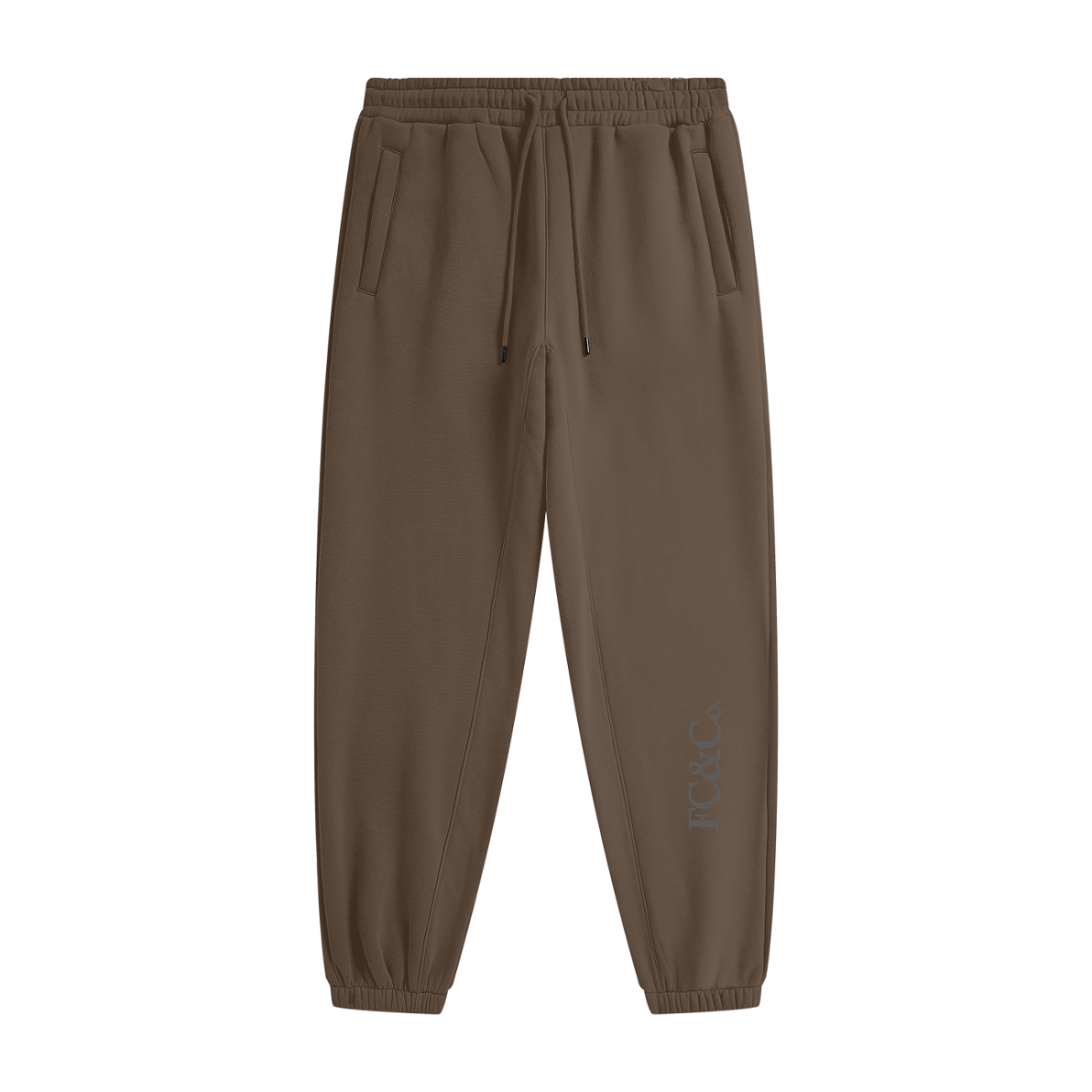 Streetwear Unisex Fleece Joggers in brown with an elastic waistband, drawstring, cuffed ankles, side pockets, and subtle FG&C Co. text near the left ankle—an affordable luxury staple—displayed on a white background.