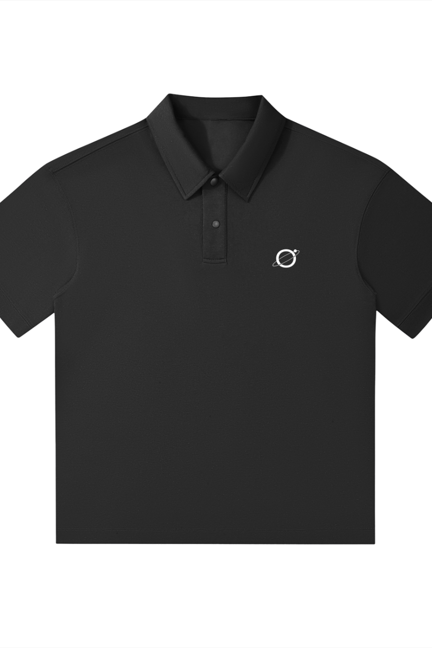 The Fusion Drop Shoulder Short-Sleeve Polo is an affordable luxury black polo with a collar, three buttons, and a small white embroidered planet logo on the left chest, shown laid flat on a white background.