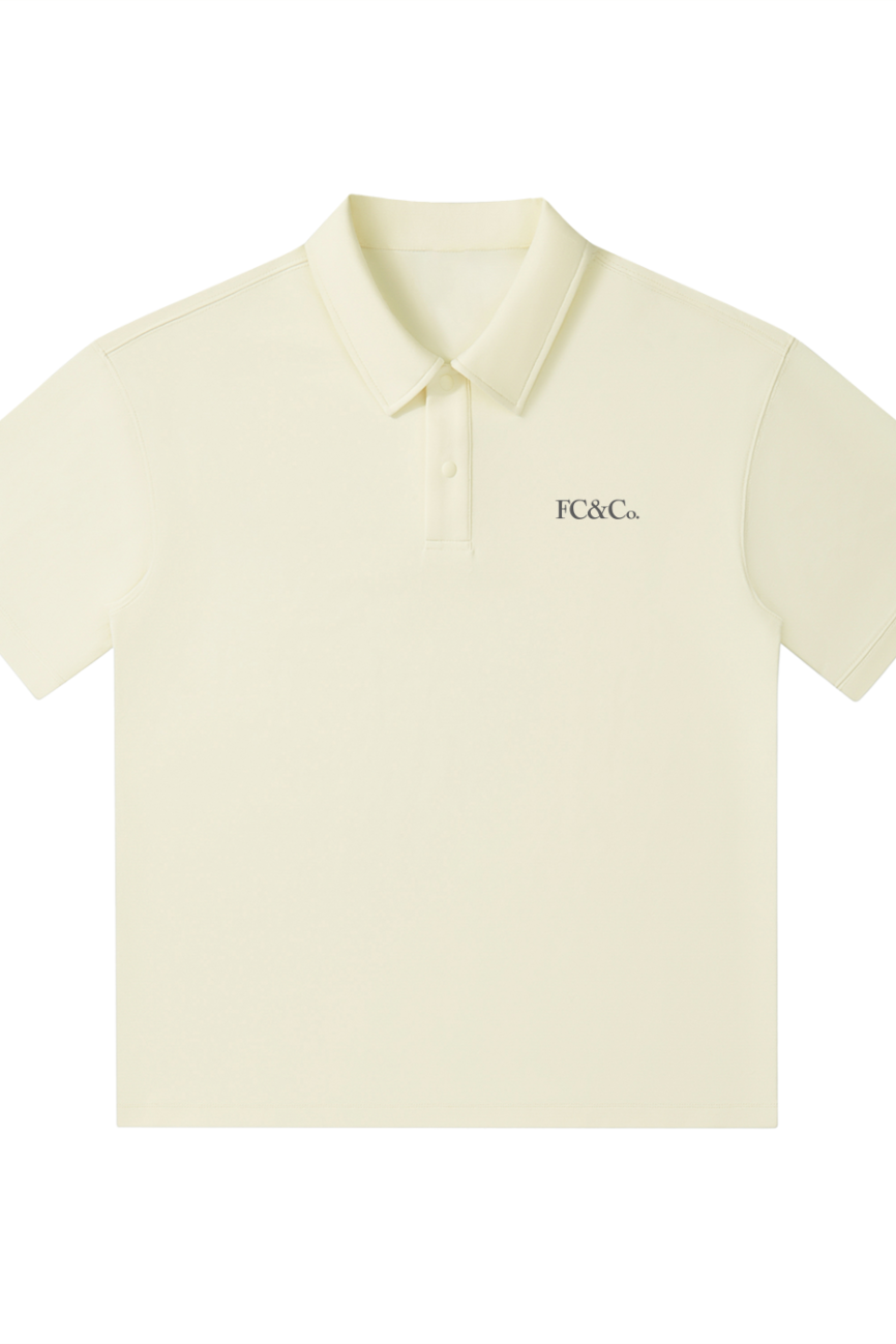 The FC&Co. Drop Shoulder Short-Sleeve Polo features a light beige color, collar, left-chest logo, and is shown on a white background—an ideal pick for fans of affordable luxury style.