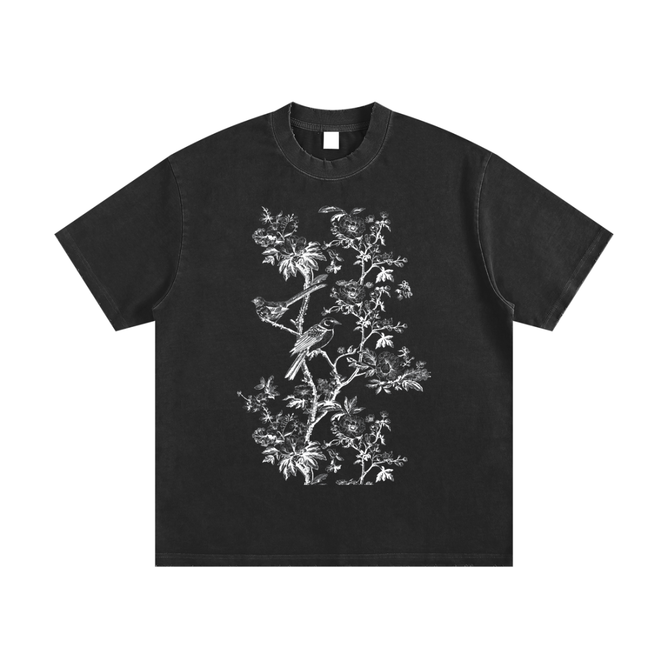 The Toile De Jouy Heavyweight Vintage Washed Frayed T-Shirt features a detailed white botanical and bird illustration on black—an affordable luxury piece that adds exquisite style to your everyday wardrobe.