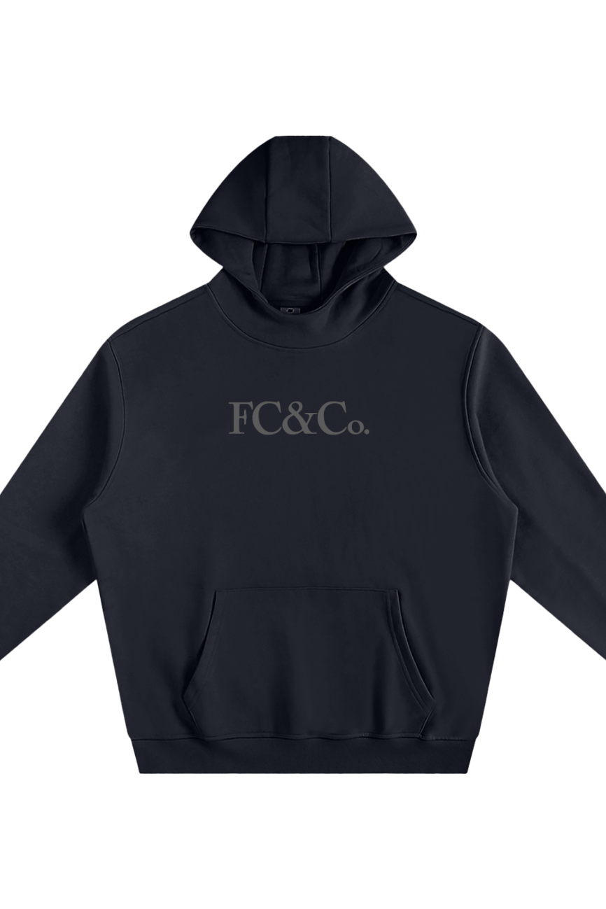 The Fleeced High Neck Hoodie features a black design with a front pocket and FC&Co. in light gray across the chest, blending affordable luxury. Displayed on a white background.