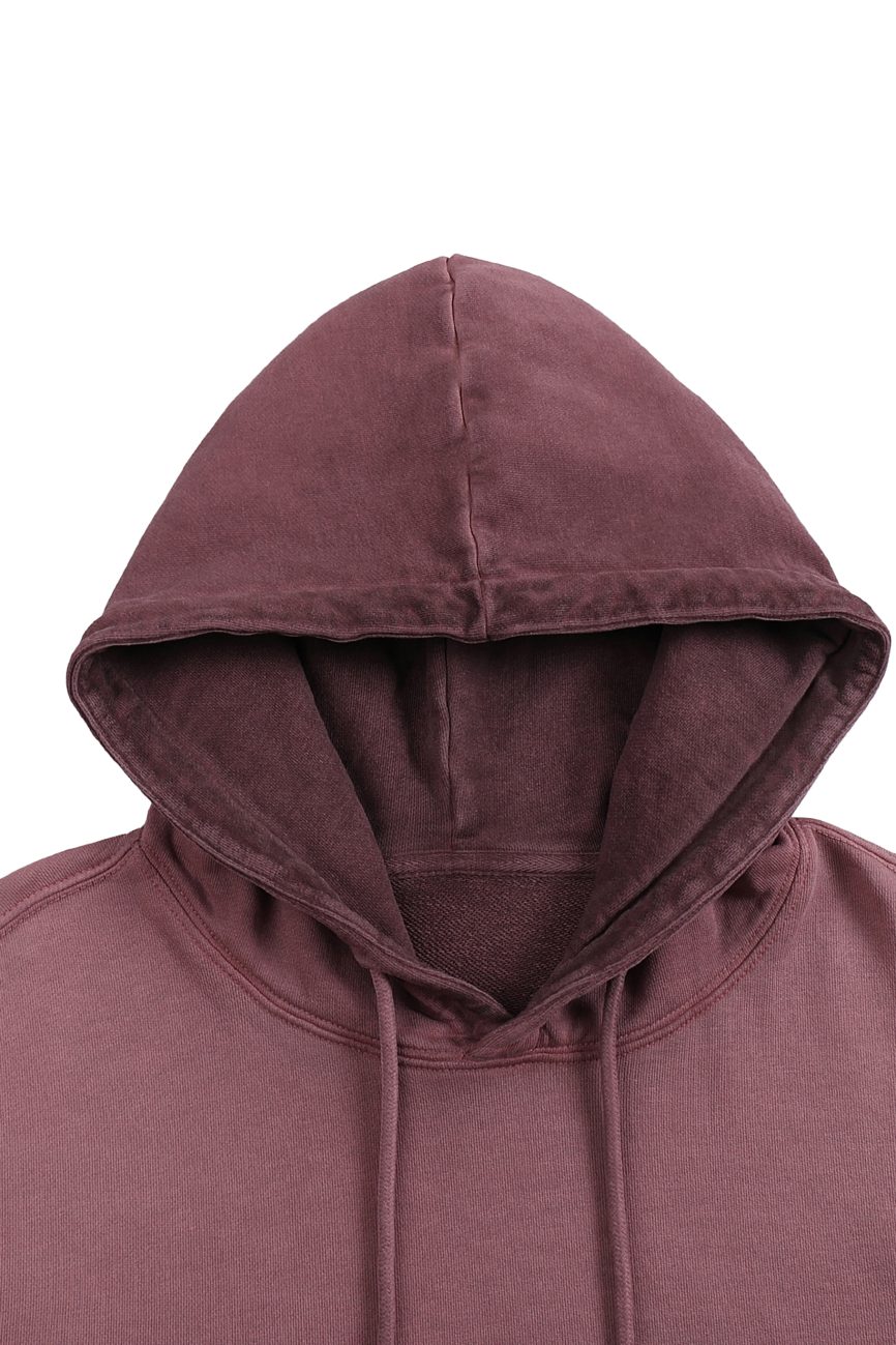 A close-up of the FC&Co. Ombre Vintage Stone Washed Colorpointed Hoodie, highlighting its maroon hue, drawstring hood, and shoulder details to showcase affordable luxury clothing against a white background.