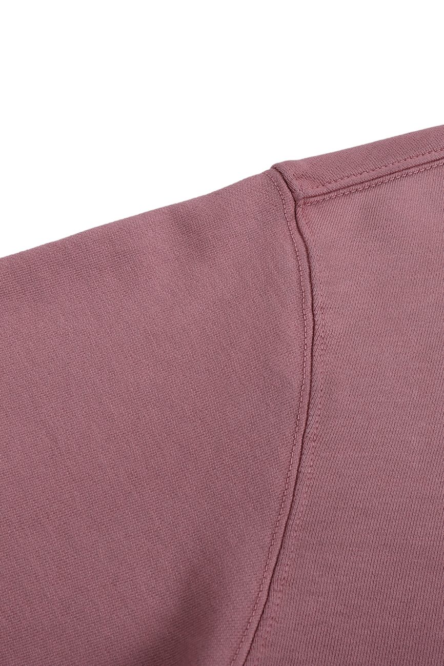 Close-up of mauve fabric with visible seam and stitching detail on the FC&Co. Ombre Vintage Stone Washed Colorpointed Hoodie—showcasing affordable luxury in a premium sweatshirt.