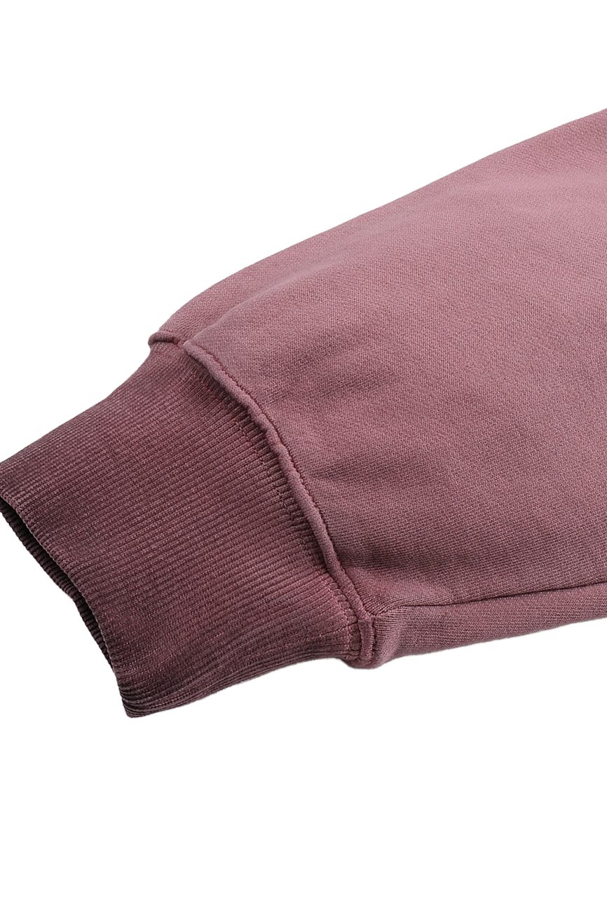 A close-up of the FC&Co. Ombre Vintage Stone Washed Colorpointed Hoodie sleeve with a ribbed cuff, isolated on white, highlights the hoodie’s affordable luxury details.