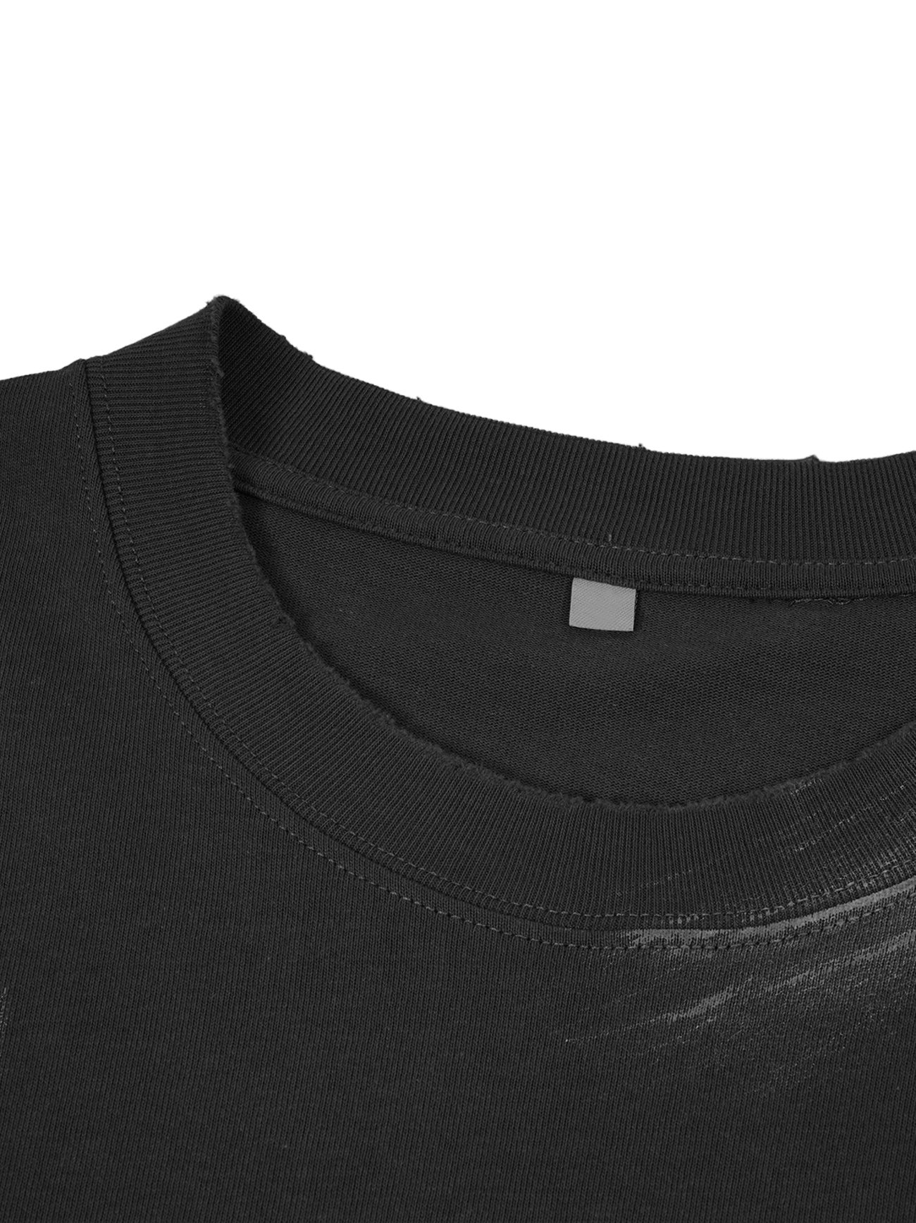 Close-up of the neckline of our Hand Brushed T-shirt, featuring a plain black crew neck, ribbed collar detail, and a small gray rectangular label inside from the Affordable Luxury Clothing line.