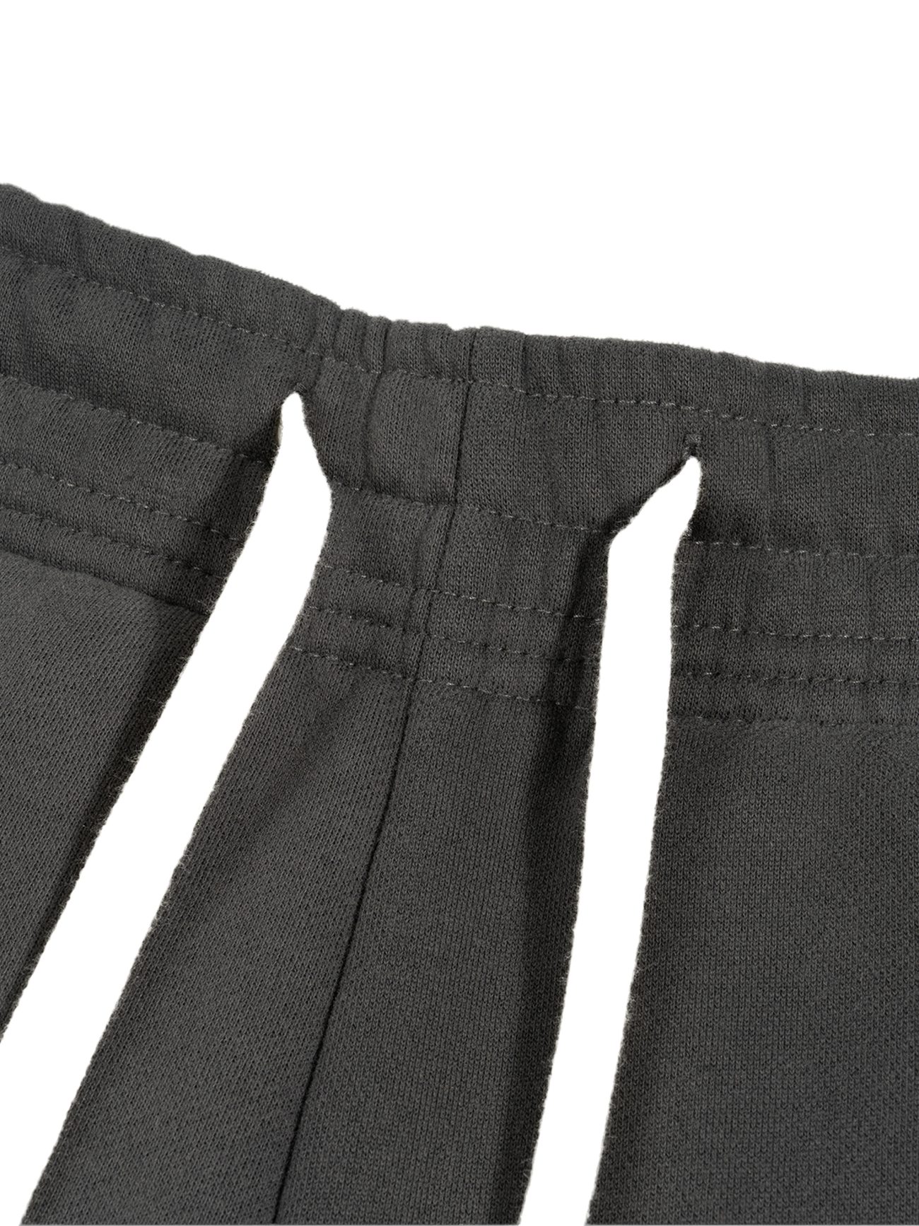 Close-up of the Sunfade Curved Blade Fleece Sweatpants in black, showcasing finely stitched seams and dual vertical slits—reflecting refined details found in affordable luxury, perfect for those seeking elegance in everyday wear.