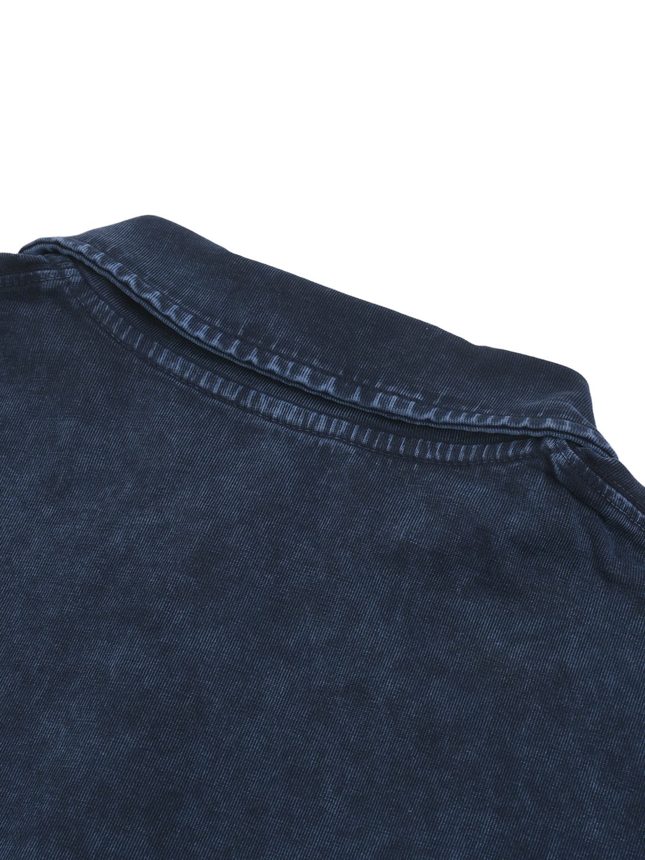 Close-up of the Fusion Heavyweight Snow-Washed Polo T-Shirt in dark blue denim, highlighting the collar and shoulder seam against a white background to showcase its fine, affordable luxury details.