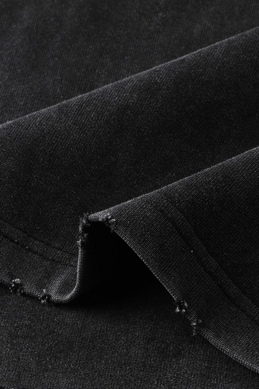 A close-up of the Toile De Jouy - Heavyweight Vintage Washed Frayed T-Shirt shows visible stitching and slightly frayed edges, highlighting the quality texture and weave typical of affordable luxury clothing.