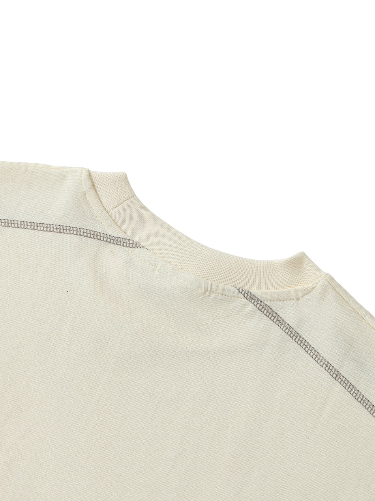 Close-up of the upper back and neckline of the Crane - Oversized Contrast-Stitched Cotton Tee, highlighting its detailed stitching and ribbed collar—an elegant approach to affordable luxury, set against a white background.