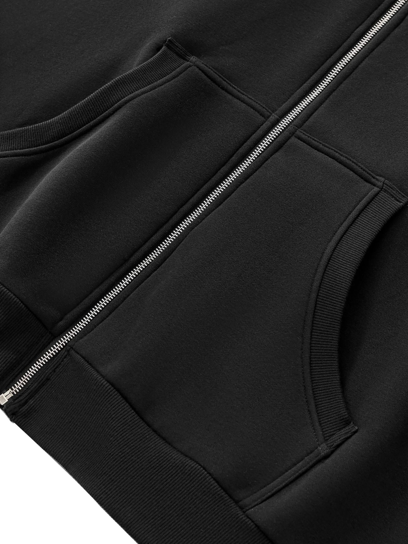 Close-up of the FC&Co. Fleeced Full-Zip Boxy Hoodie featuring a metal zipper and two ribbed front pockets on soft, smooth fabric—an affordable luxury essential.